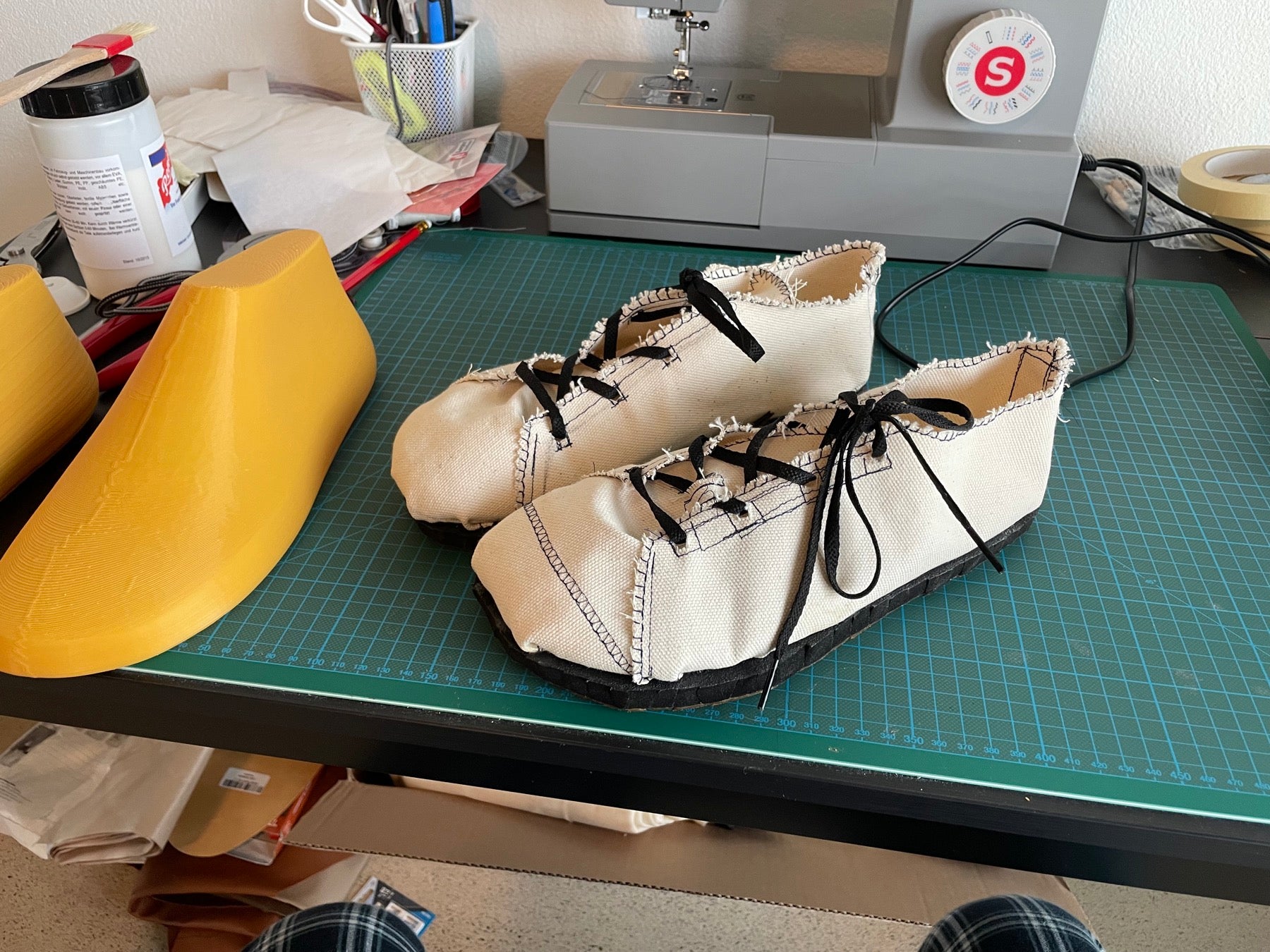 Handmade Footle fit prototypes beside the original shoe lasts